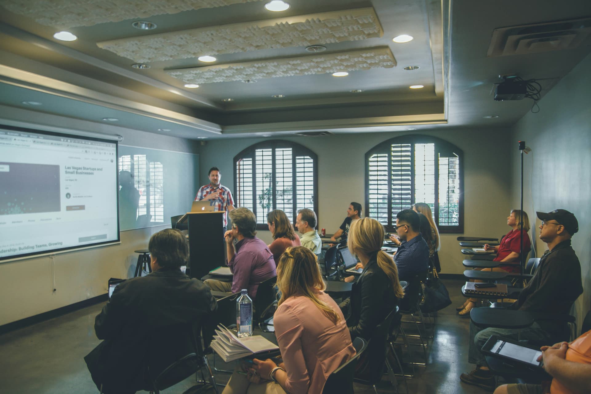 An instructor leading a technical training session in a classroom